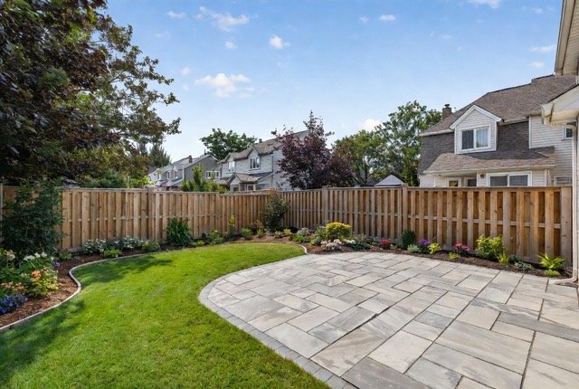Backyard patio with stone and landscaping