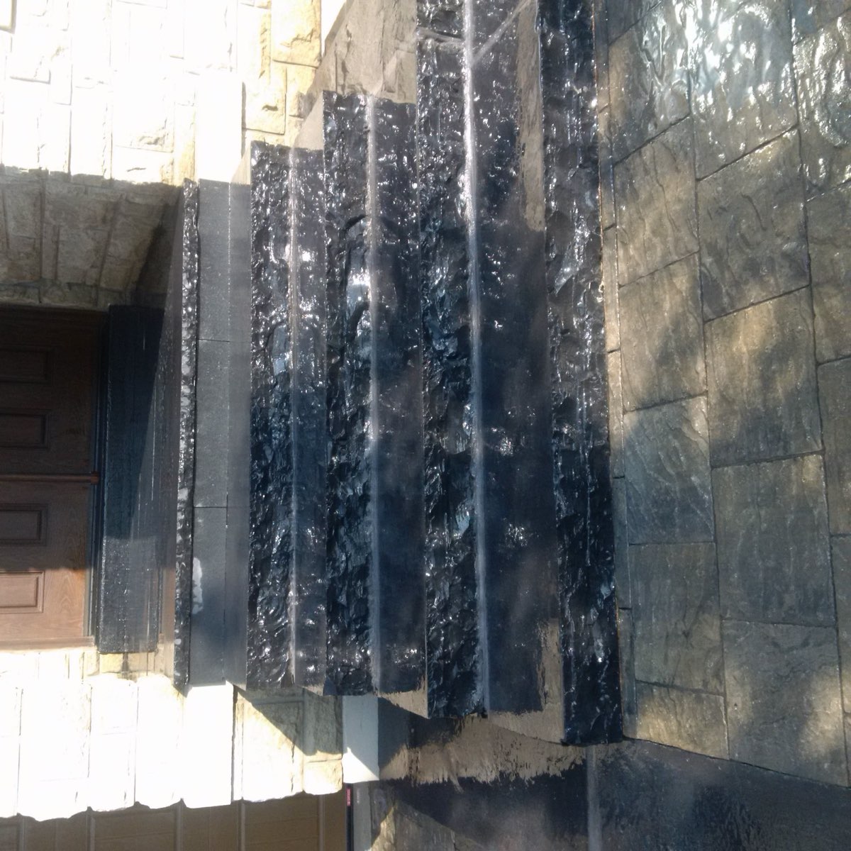 Stone water feature by Total Landscaping Services