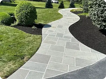 Interlocking stone walkway with landscaping